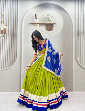 Parrot green and royal blue pure cotton Navratri lehenga choli with heavy ribbon work, Lampi lace border, and embroidered dupatta