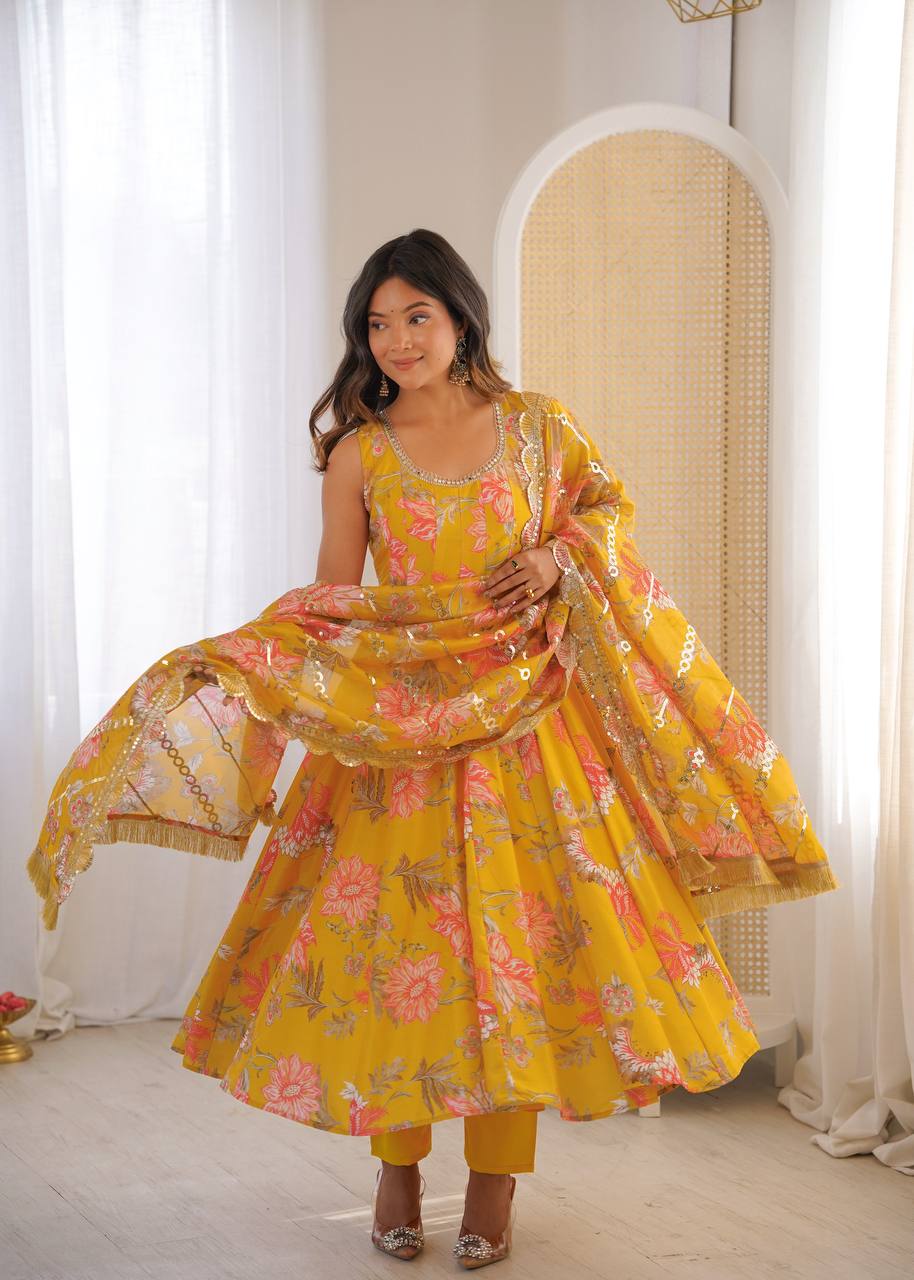 Yellow Pure Muslin Anarkali Suit featuring a Kali cut flare, beautiful floral prints, and a scallop border dupatta by The Beauty Queen
