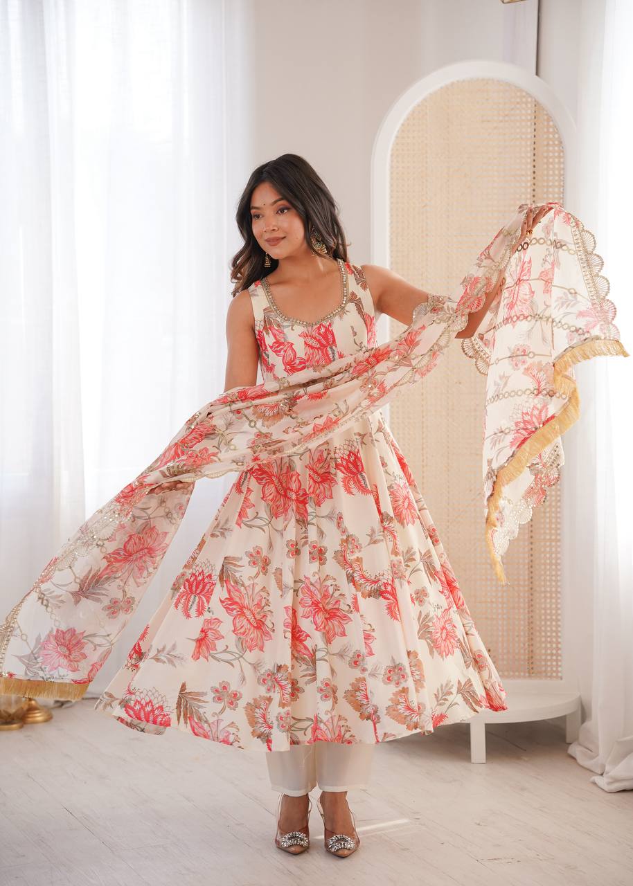 Off-White Pure Muslin Anarkali Suit featuring a Kali cut flare, vibrant red-floral prints, and a scallop border dupatta by The Beauty Queen