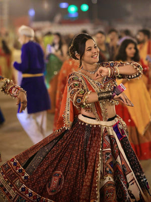 Muslin cotton traditional Navratri lehenga choli featuring Kutchi-style multi-panel digital prints, real mirror work embellishments, and a shell-tasseled blouse