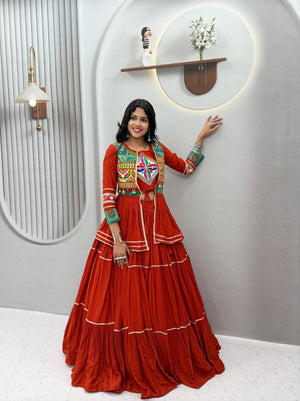 Rust orange pure cotton ready to wear Navratri lehenga choli with heavy Gamthi work, mirror lace, and Sikka coin lace Koti jacket