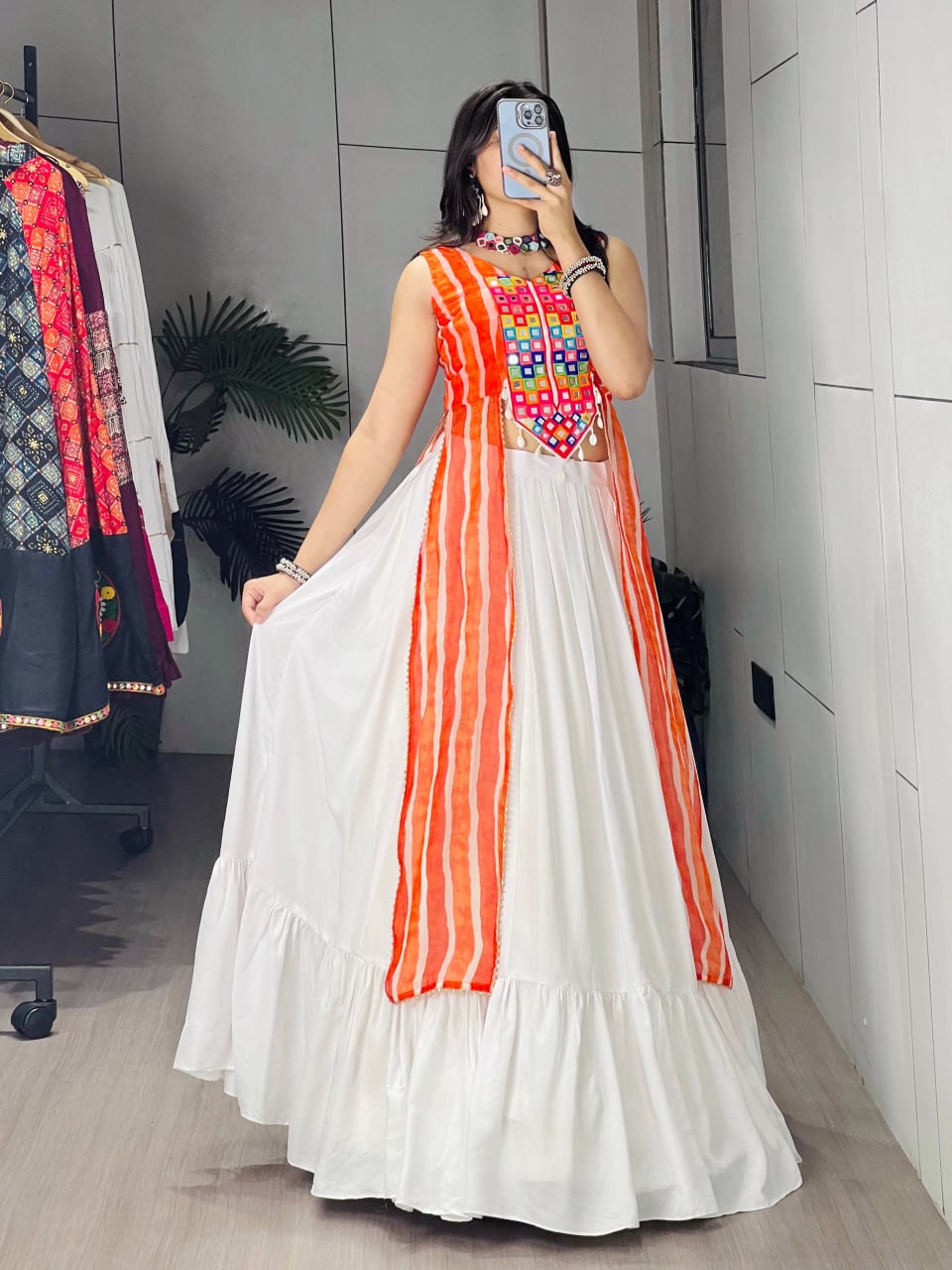 White rayon cotton Navratri chaniya choli with frill pattern and orange leheriya koti
