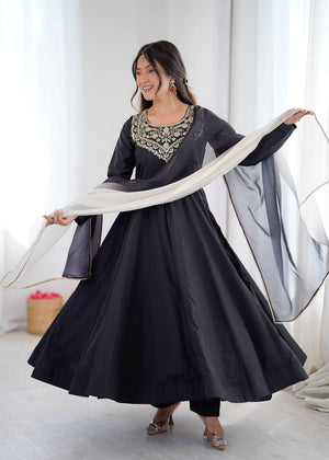 Black Pure Soft Heavy French Crape Kalicut Anarkali Suit with gold embroidery and black-cream shaded dupatta by The Beauty Queen Surat.