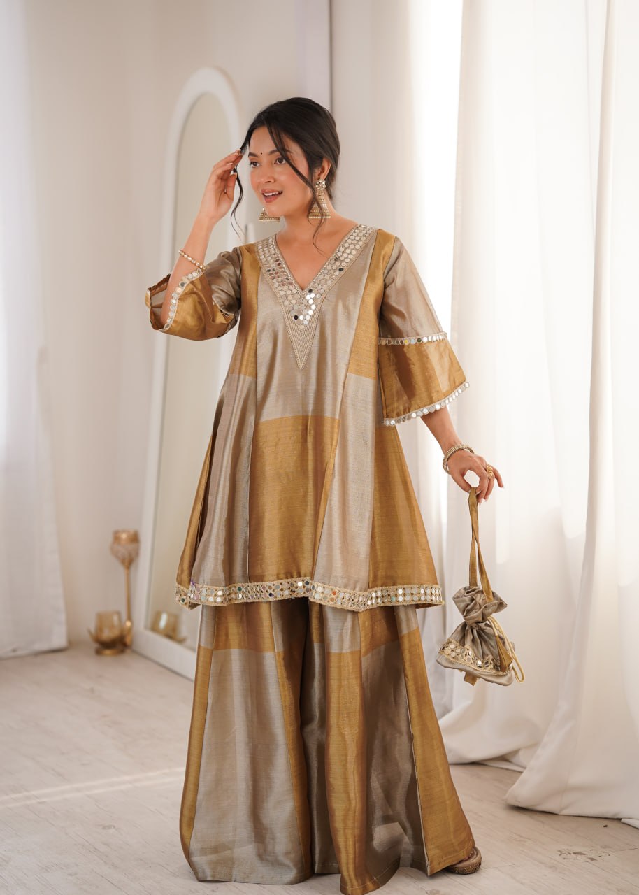 Antique Gold Two-Tone Tissue Silk Sharara Suit with coding embroidery and real mirror work lace by The Beauty Queen Surat.