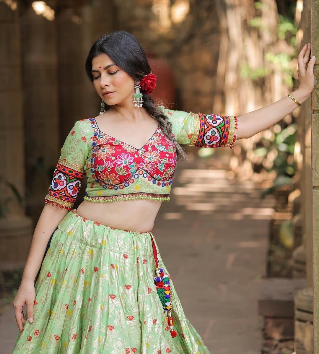 Pista green Navratri chaniya choli twirl with lampi lace border and pom pom dupatta