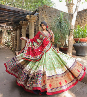 Pista green and red heavy muslin cotton Navratri chaniya choli with real mirror work and lampi lace border
