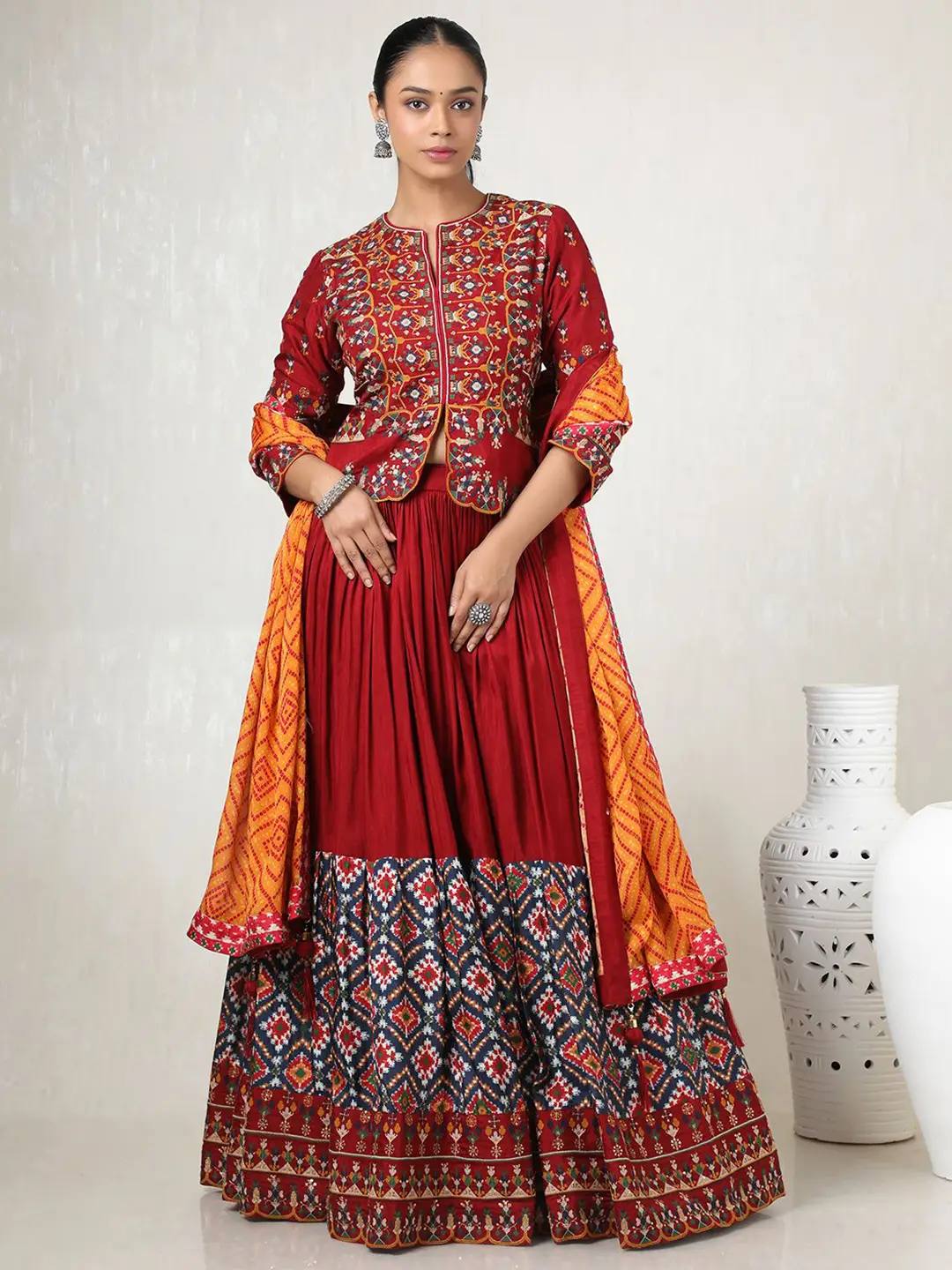 Maroon heavy muslin cotton Navratri lehenga choli with patola print and embroidered koti
