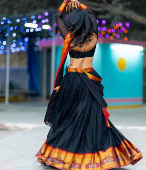 Modern South Indian half saree lehenga black with red contrast peacock border
