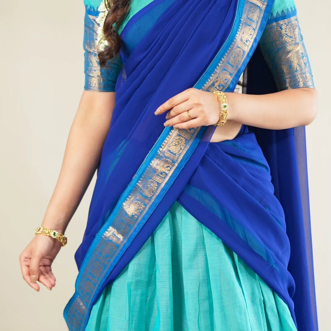 Traditional half saree with woven gold zari border turquoise blue

