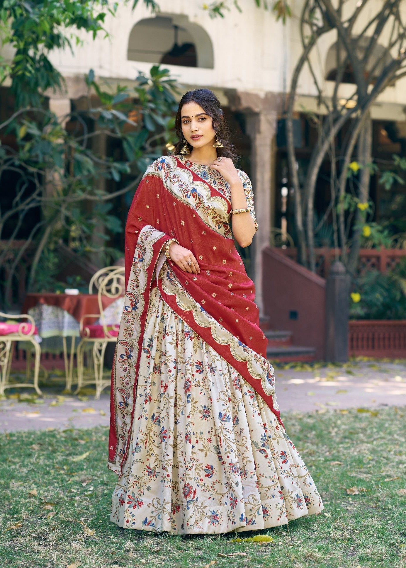 Ivory White Tasar Silk Lehenga with Brick Red Dupatta and Gilded Motif Floral Print by The Beauty Queen Surat
