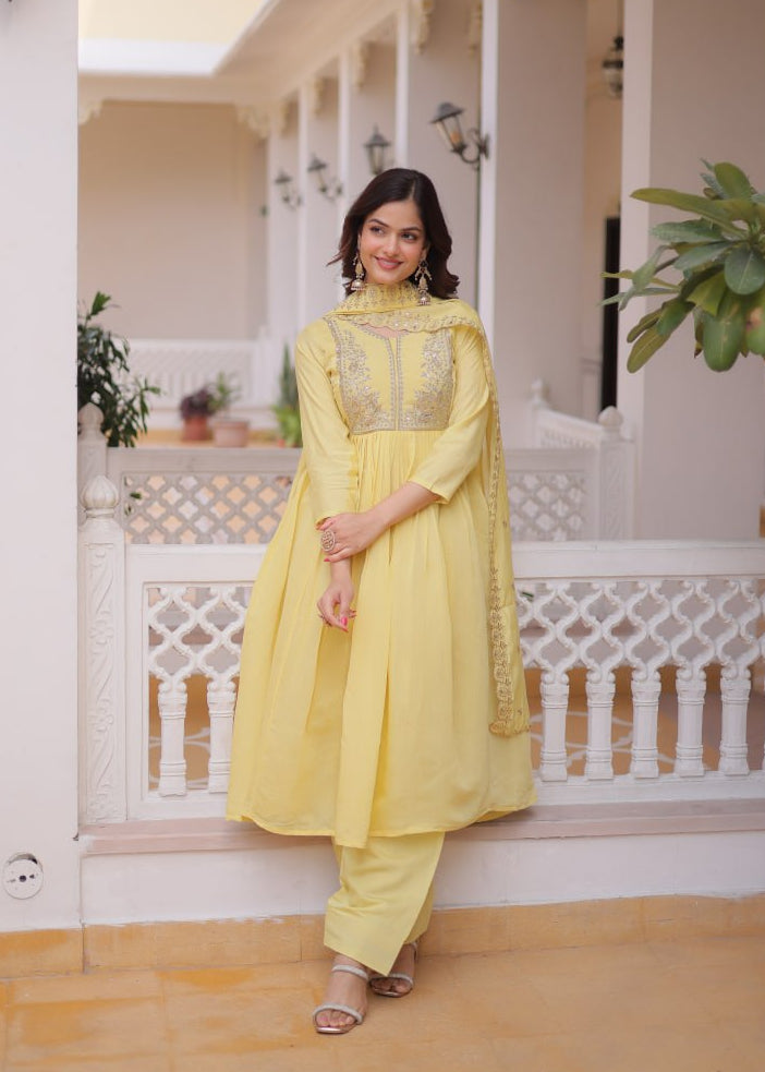 Yellow Mal Chanderi Anarkali Suit with handcrafted beads embroidery and matching dupatta by The Beauty Queen Surat.