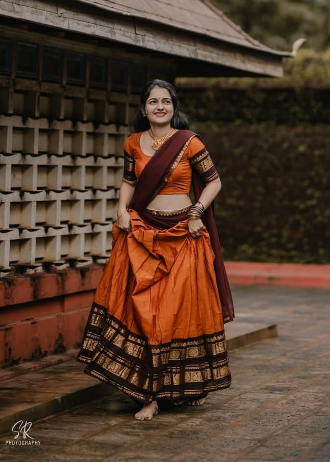 South Indian langa voni in burnt orange Kanchi cotton with maroon dupatta
