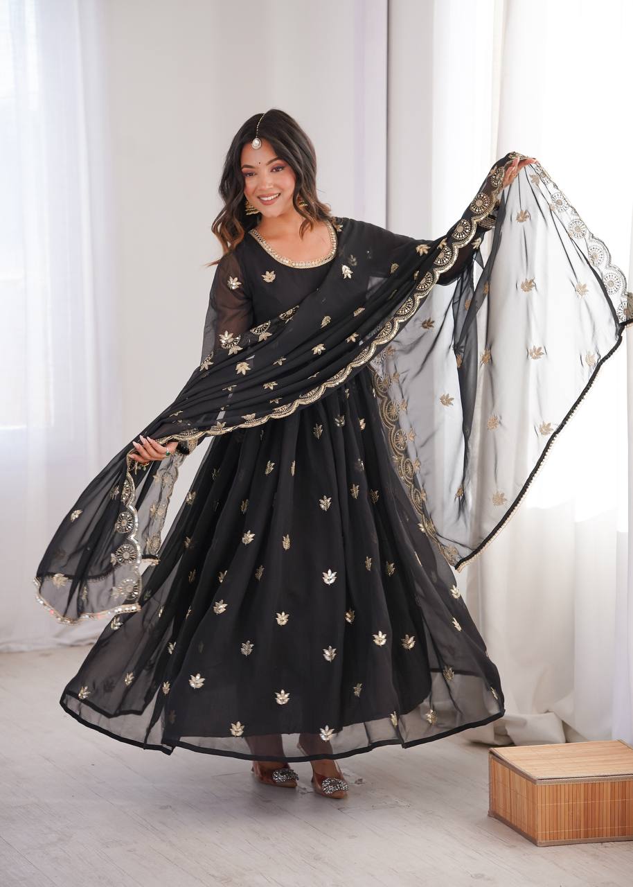 Jet Black Georgette Anarkali Suit with gold sequence embroidery and scalloped dupatta by The Beauty Queen Surat.