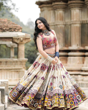 Off-white Navratri chaniya choli with Kutchi mirror work

