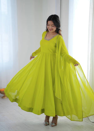 Lime Green Pure Fox Georgette Kalicut Anarkali Suit with heavy flare and embroidered neck by The Beauty Queen Surat.