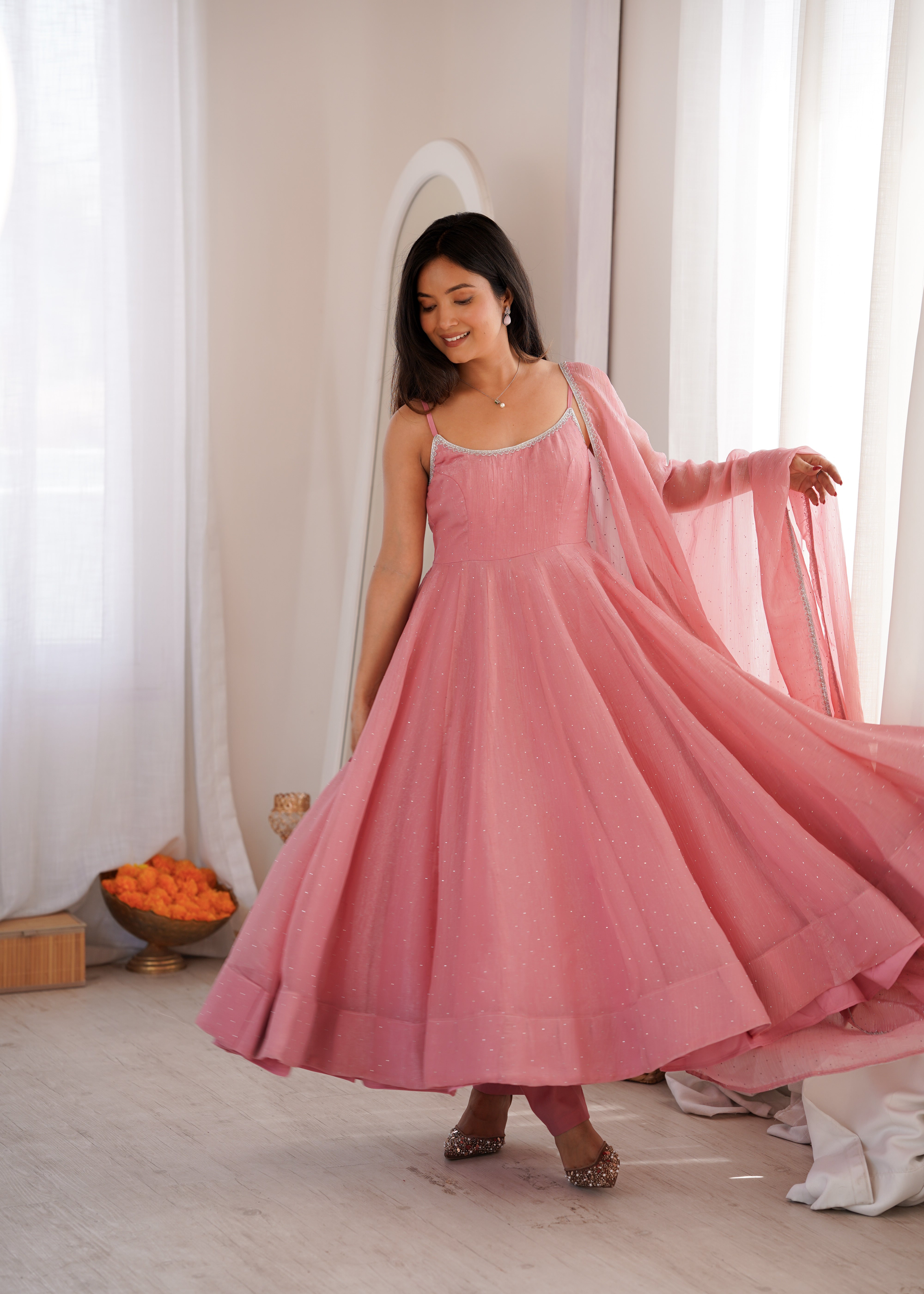 Festive rose pink Anarkali suit with Swarovski sparkle for receptions
