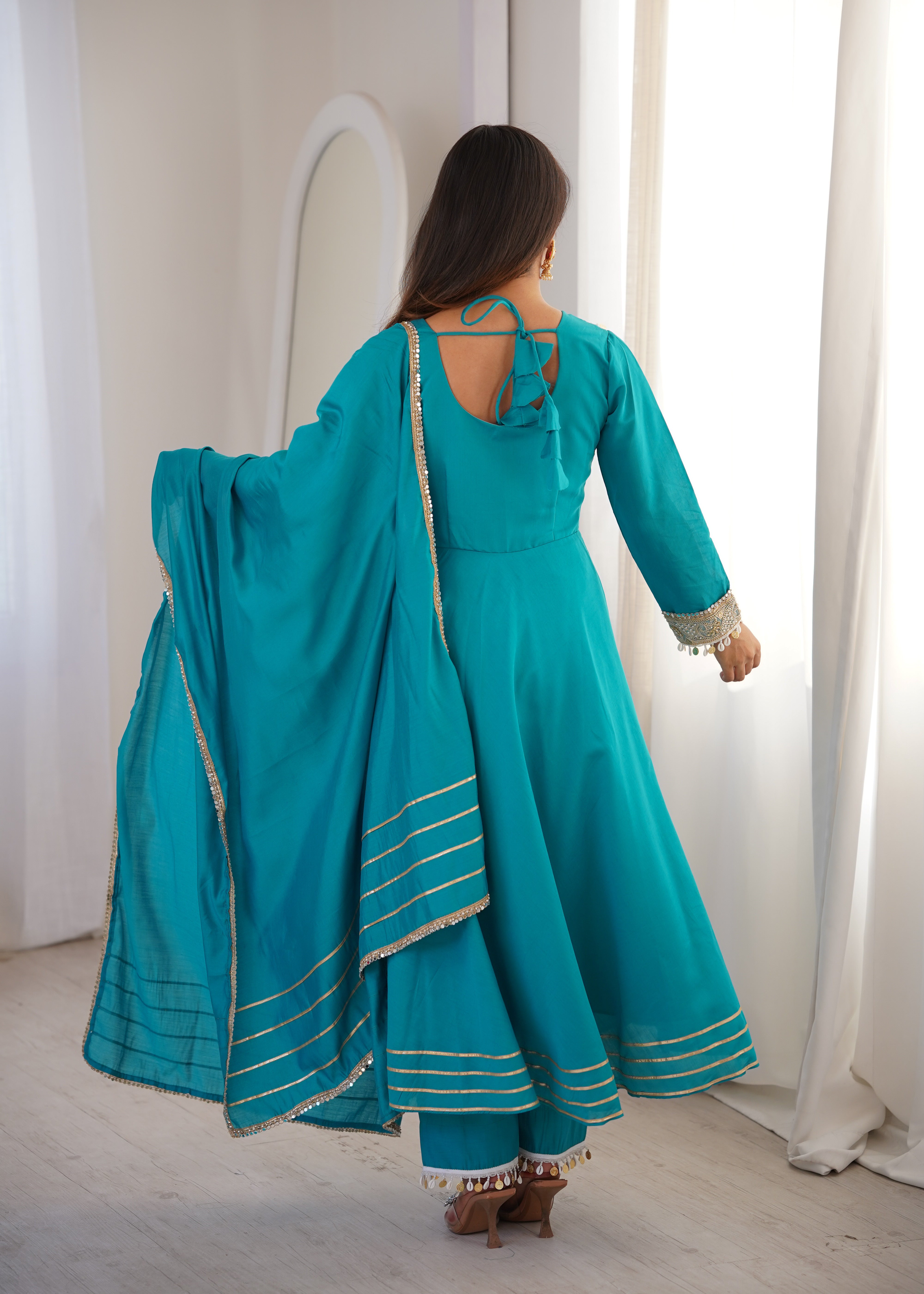 Designer teal Anarkali suit with V-neck embroidery
