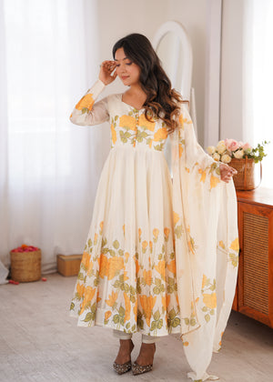 Romantic floral Anarkali suit ivory with mustard yellow blooms

