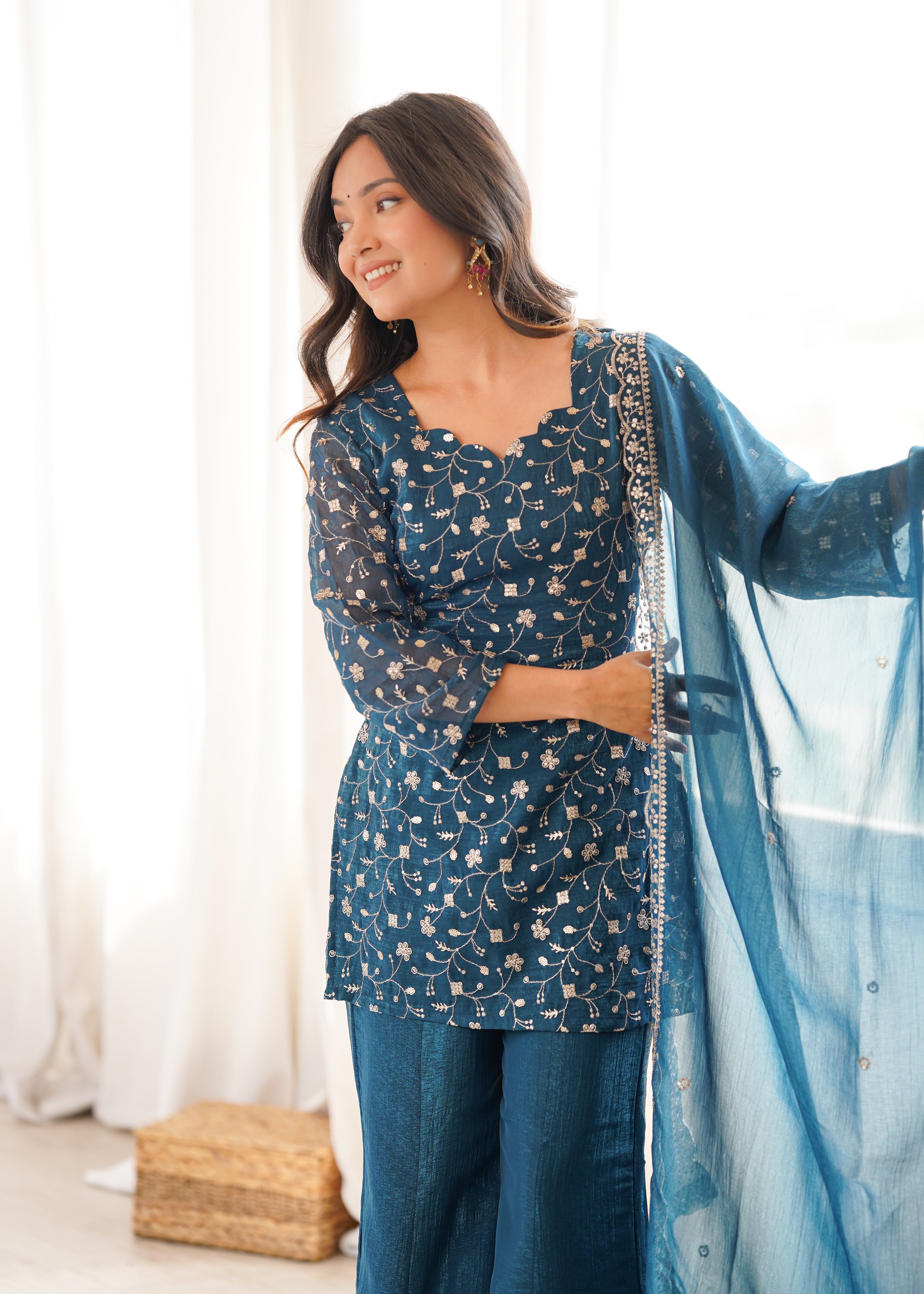 Peacock blue embroidered kurti with flared sharara pants
