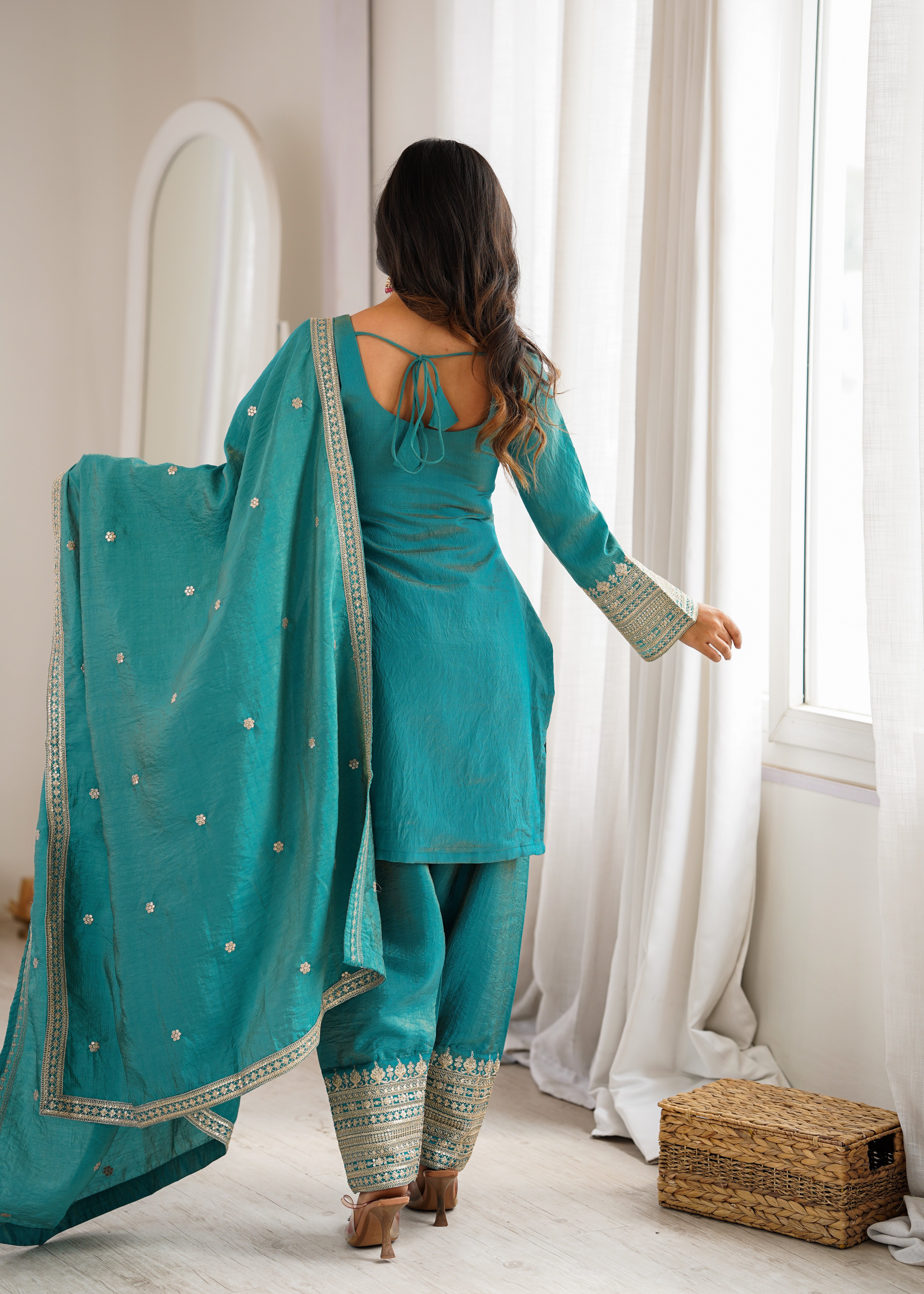 Designer sea green Vichitra silk suit with embellished hem and yoke embroidery
