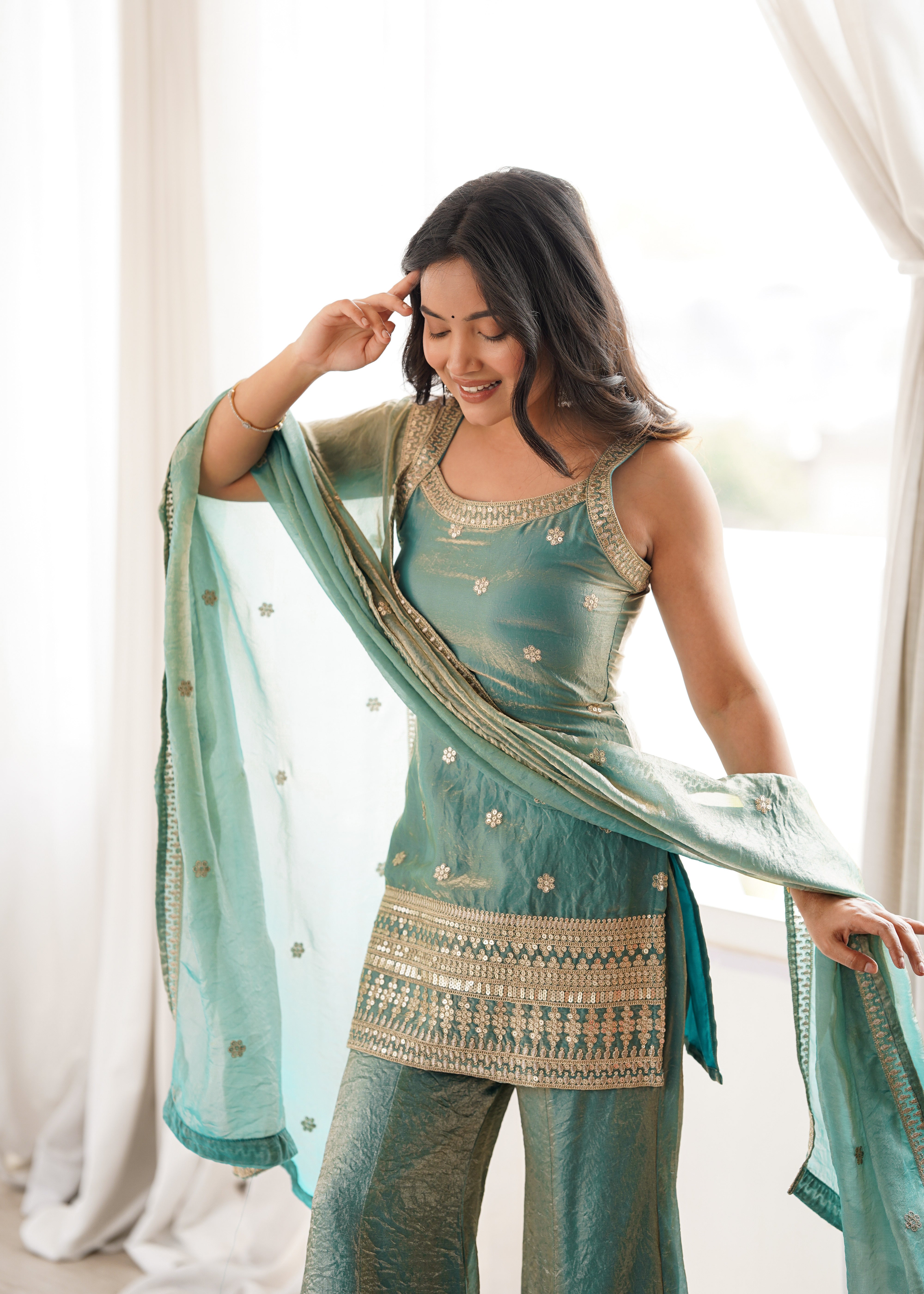 Tissue silk kurti sharara dupatta sleeveless gold embroidery