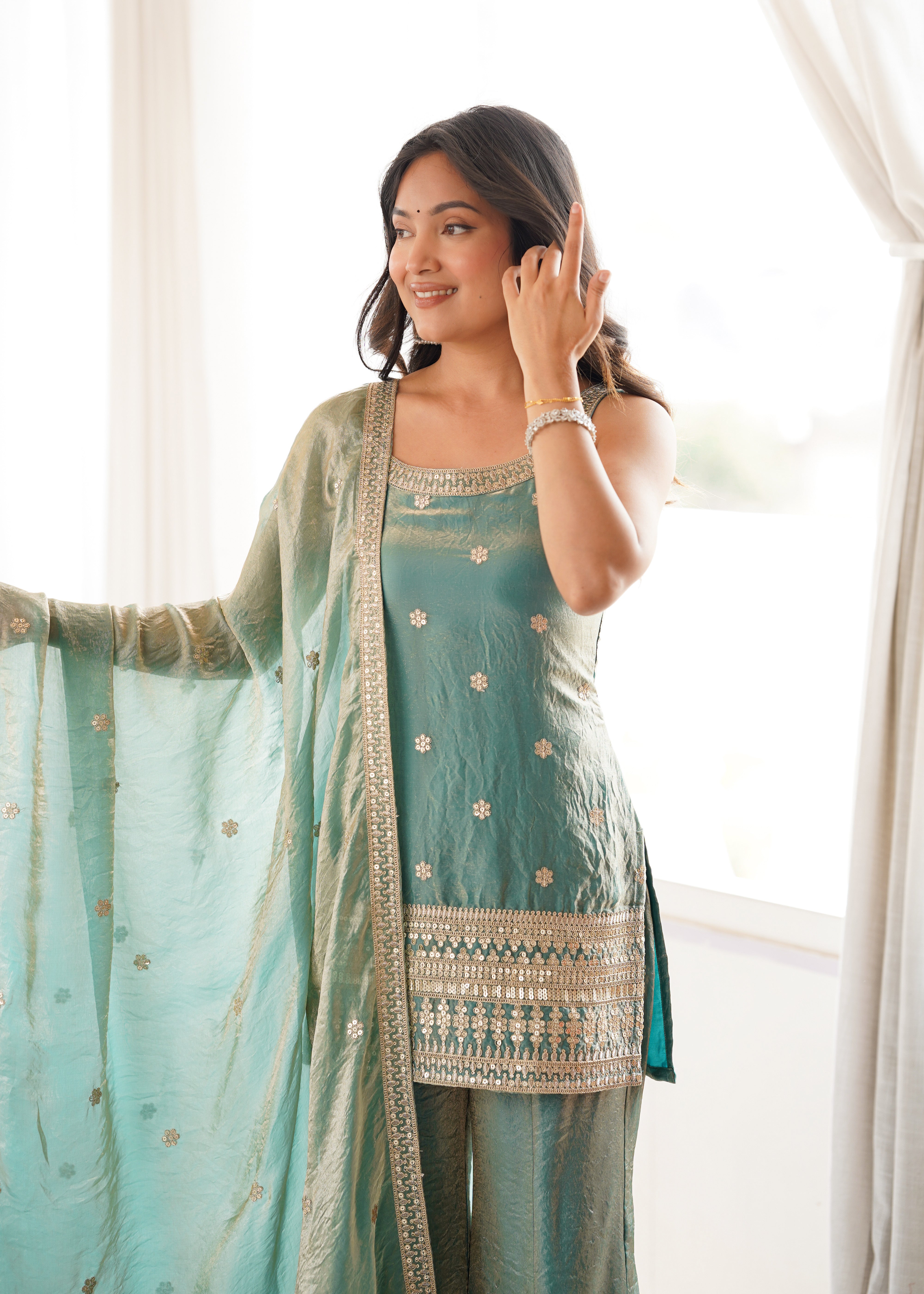 Mint green tissue silk kurti with flared sharara pants

