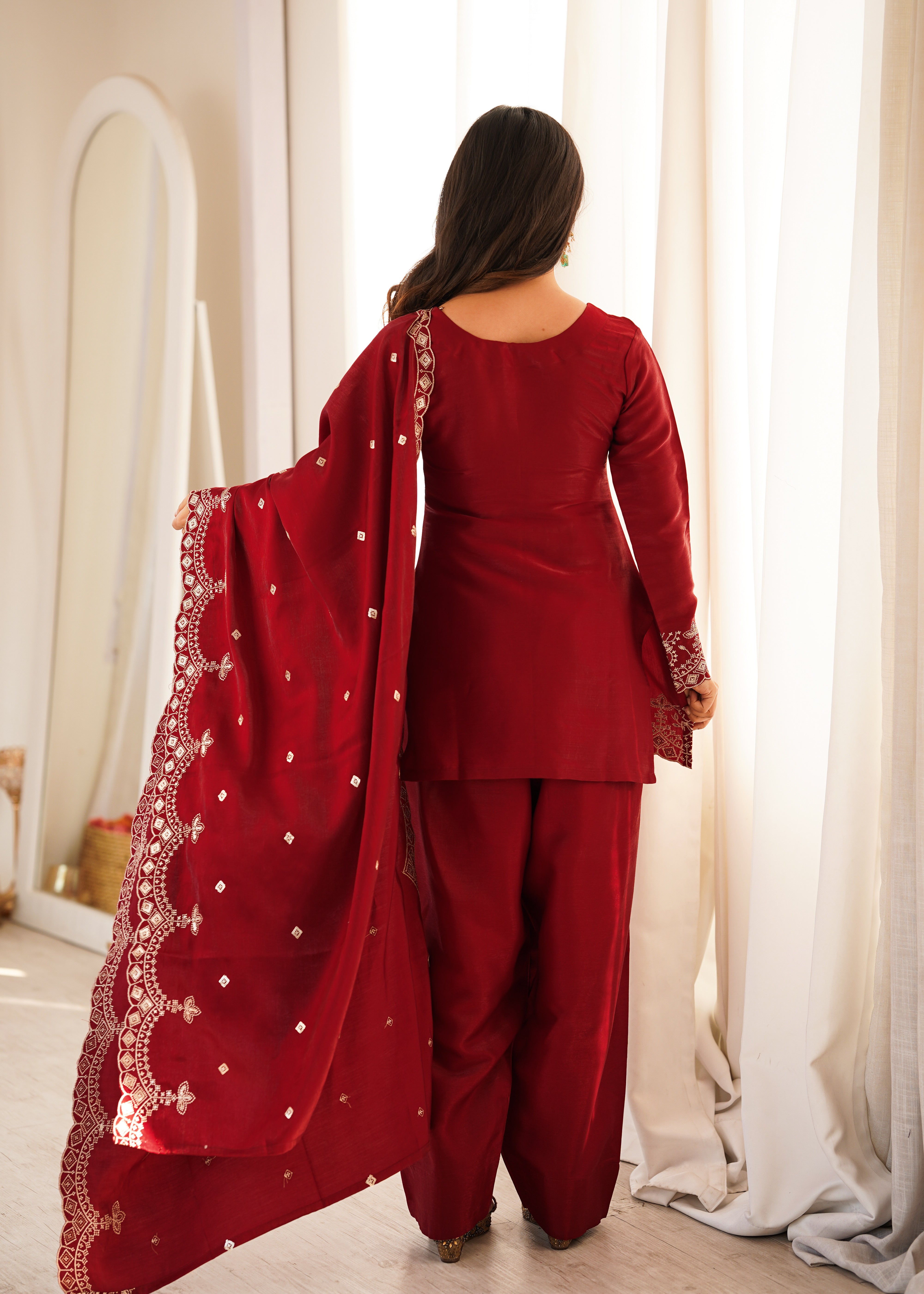 Designer maroon glass roman silk suit with scalloped embroidered hem
