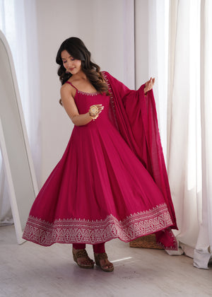 Rani pink pure roman silk fully flared Anarkali suit with embroidered border and dupatta
