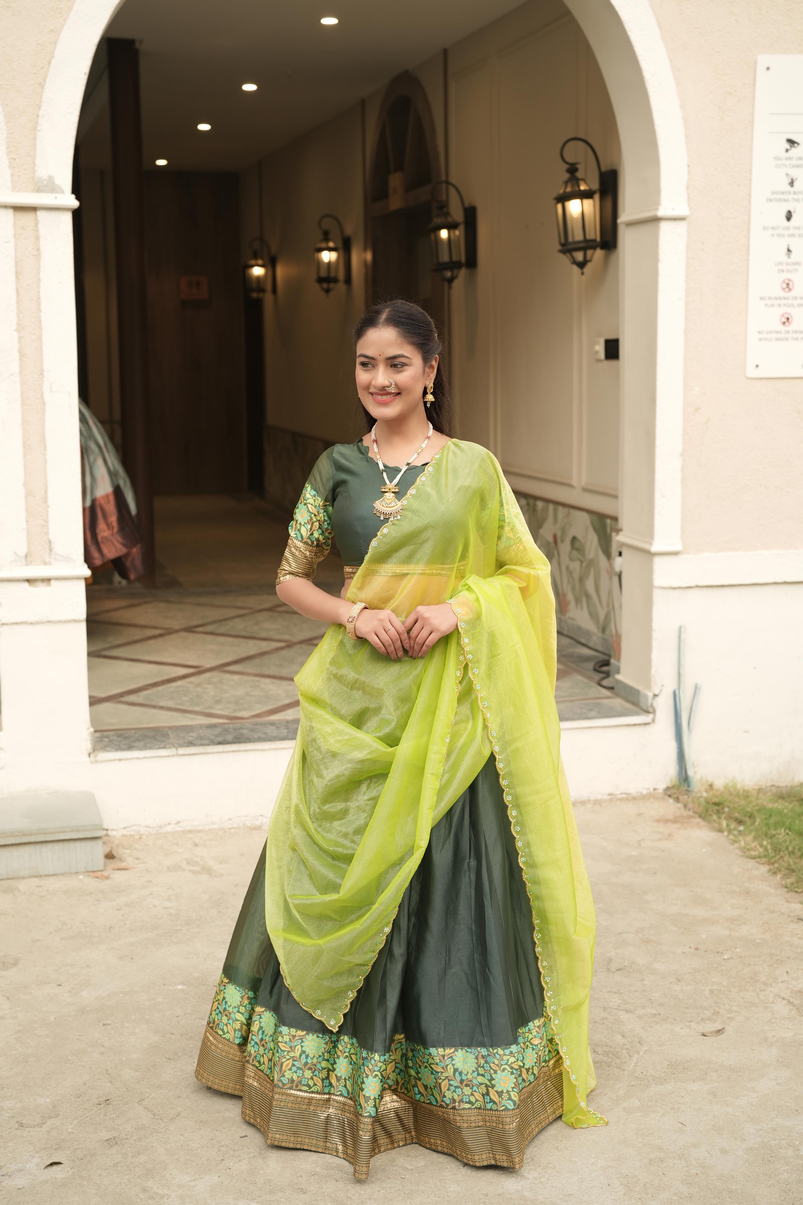 Dark Green Shimmer Lehenga Choli featuring a rich gold-silver zari weaving border paired with a contrasting lime green scalloped dupatta by The Beauty Queen