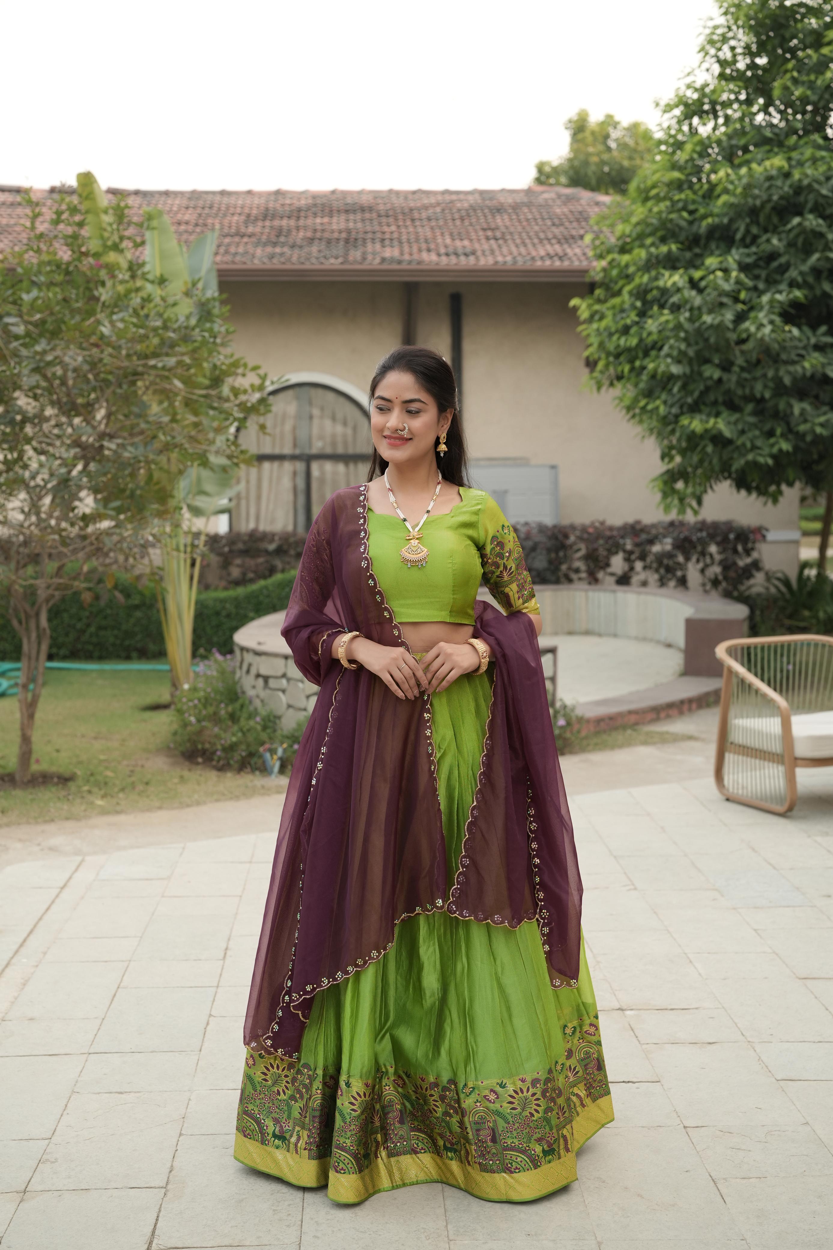 Lime Green Shimmer Lehenga Choli featuring a rich silver-golden zari weaving border paired with a contrasting wine purple scalloped dupatta by The Beauty Queen