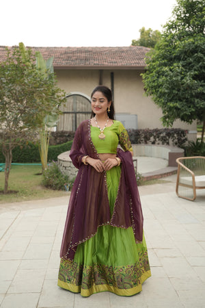 Lime Green Shimmer Lehenga Choli featuring a rich silver-golden zari weaving border paired with a contrasting wine purple scalloped dupatta by The Beauty Queen