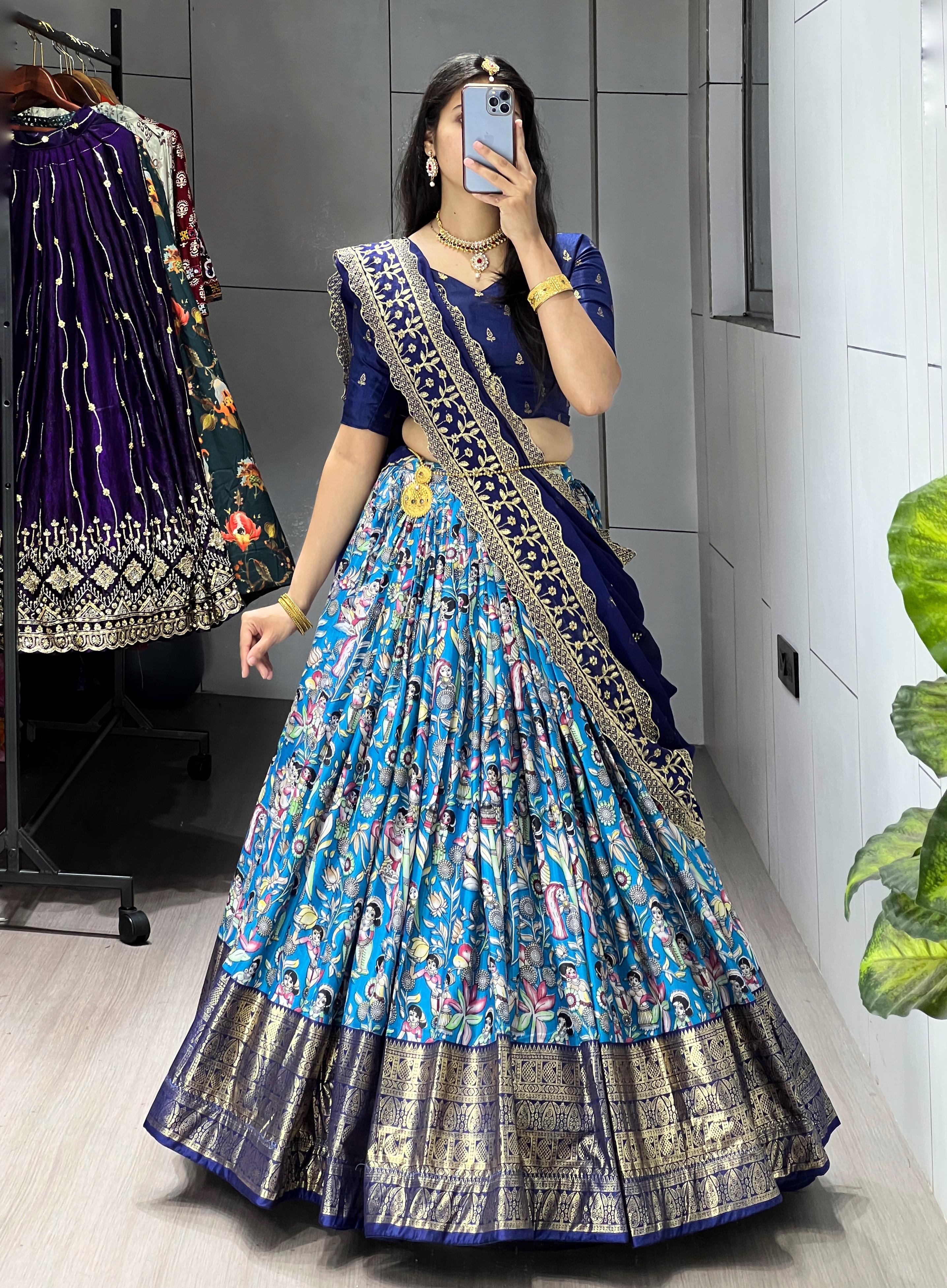 Blue Soft Dola Silk Lehenga Choli featuring an all-over traditional print and a heavy golden contrast foil work border by The Beauty Queen