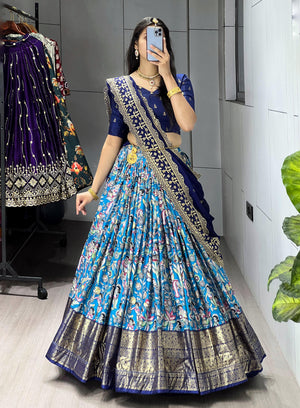 Blue Soft Dola Silk Lehenga Choli featuring an all-over traditional print and a heavy golden contrast foil work border by The Beauty Queen