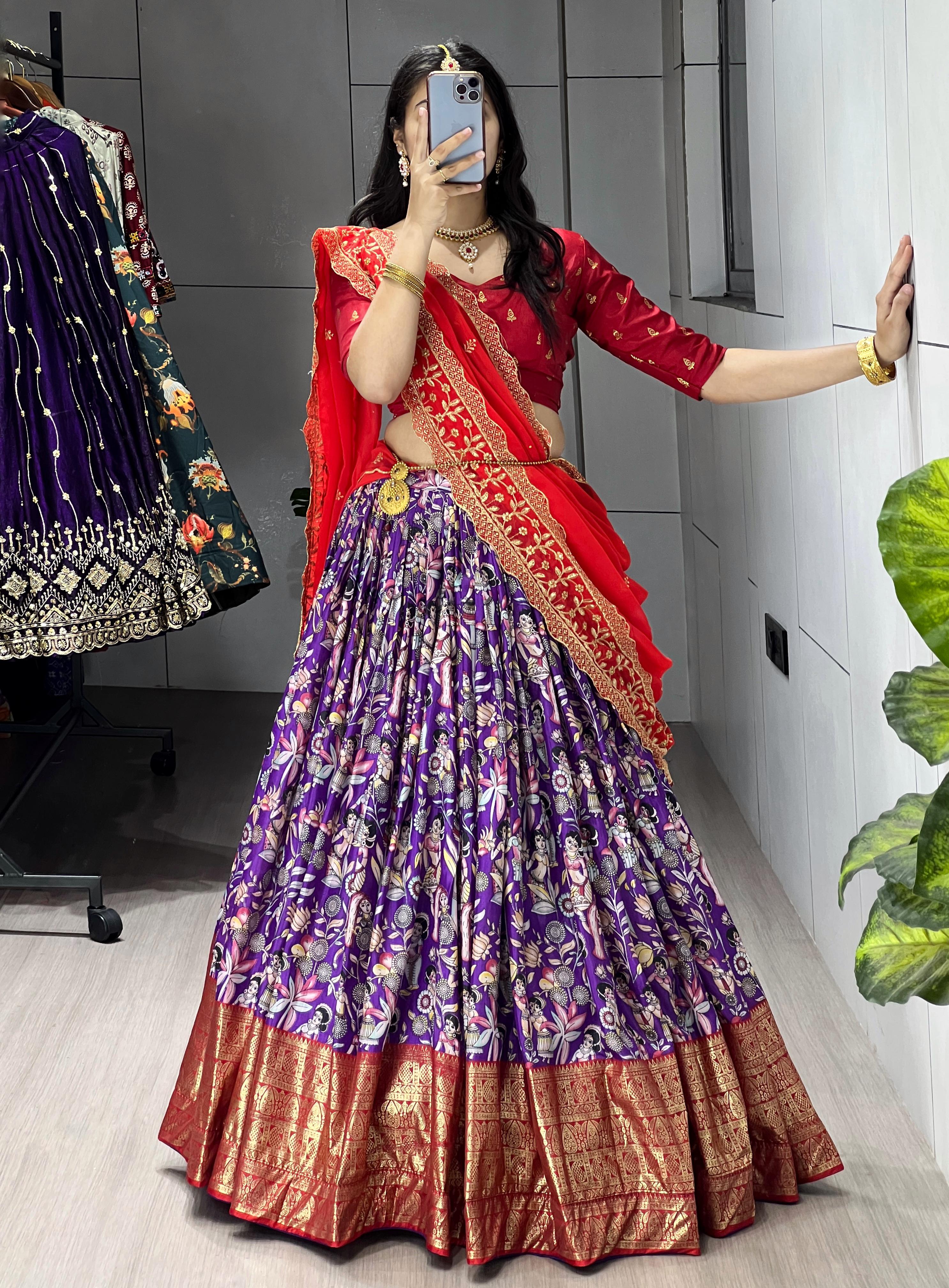 Purple Soft Dola Silk Lehenga Choli featuring an all-over traditional print and a heavy red contrast gold foil work border by The Beauty Queen