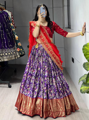 Purple Soft Dola Silk Lehenga Choli featuring an all-over traditional print and a heavy red contrast gold foil work border by The Beauty Queen