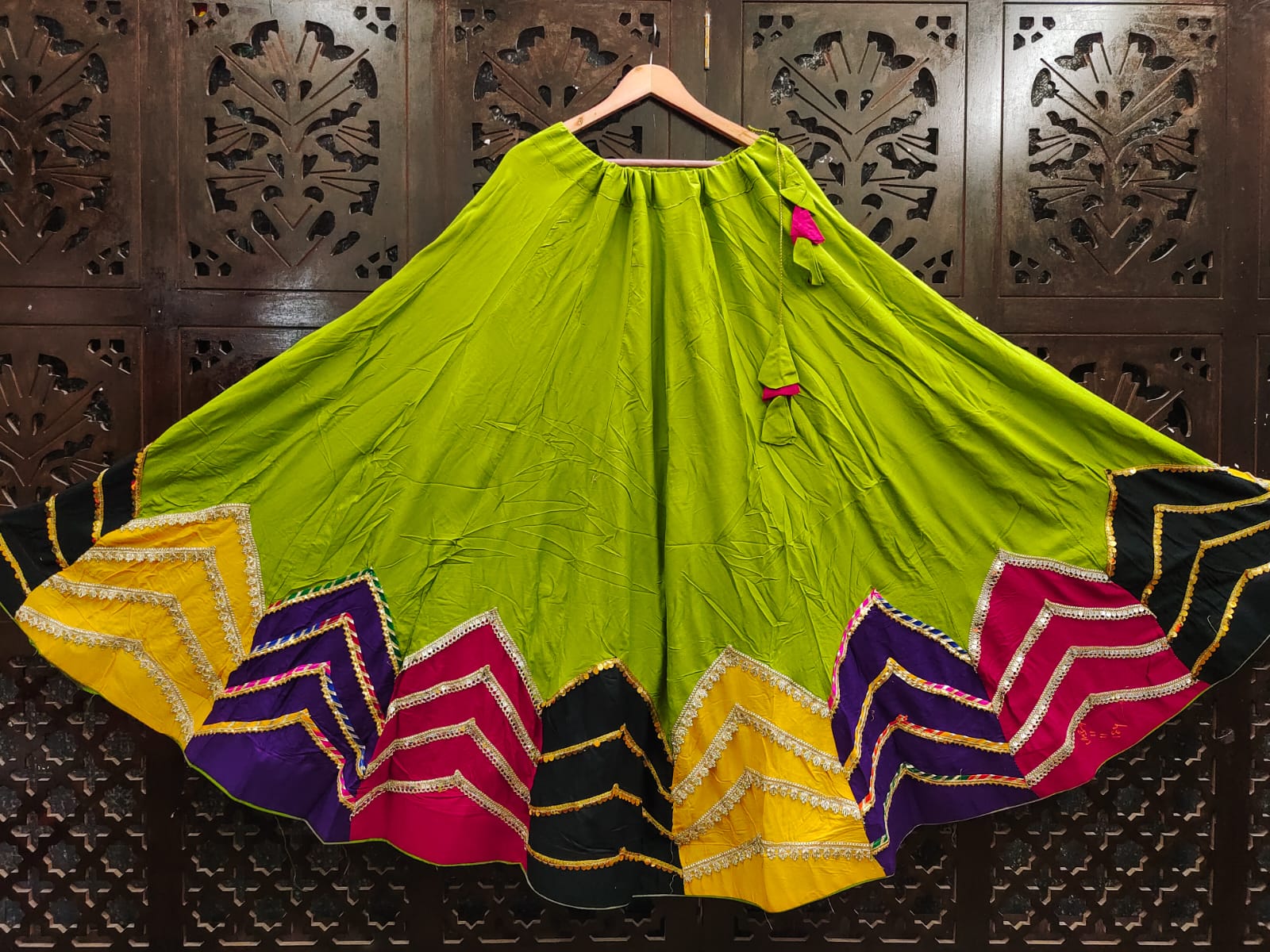 Vibrant Parrot Green Rayon Cotton Navratri Special High-Flare Stitched Lehenga Skirt with Multi-Color Chevron Patchwork Border, Silver Lace Work & Latkan Drawstring