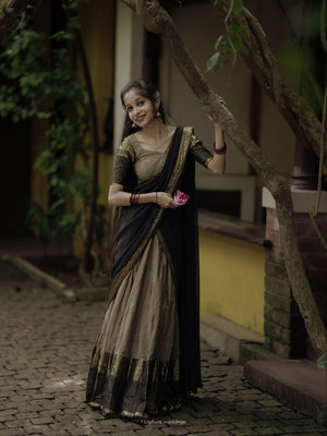 Beige Gold and Jet Black Kanci Cotton Zari Weaving Work South Indian Half Saree Lehenga Choli Set flat lay view by The Beauty Queen