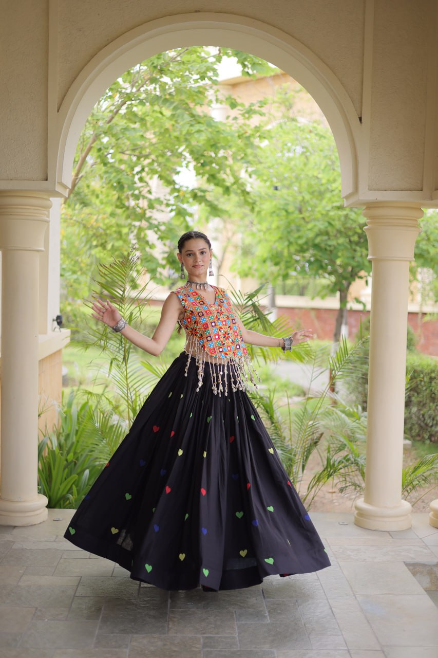 Model Twirling In Black Cora Cotton Heart Thread Embroidery Navratri Lehenga Choli Set By The Beauty Queen