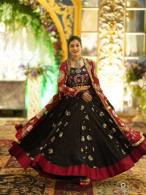 Model Wearing Black Heavy Muslin Cotton Real Mirror Work Navratri Lehenga Choli Set With Maroon Shrug Jacket By The Beauty Queen