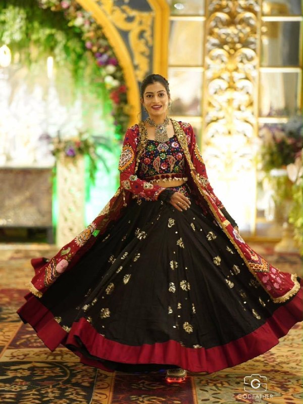 Model Wearing Black Heavy Muslin Cotton Real Mirror Work Navratri Lehenga Choli Set With Maroon Shrug Jacket By The Beauty Queen