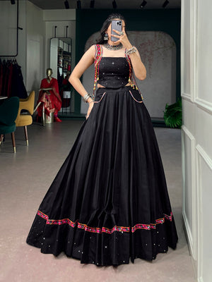 Model wearing Black Pure Cotton Fabric With Mirror Work And Kutchi Lace & Multicolor Handmade Tassel Navratri Lehenga Choli Set by The Beauty Queen
