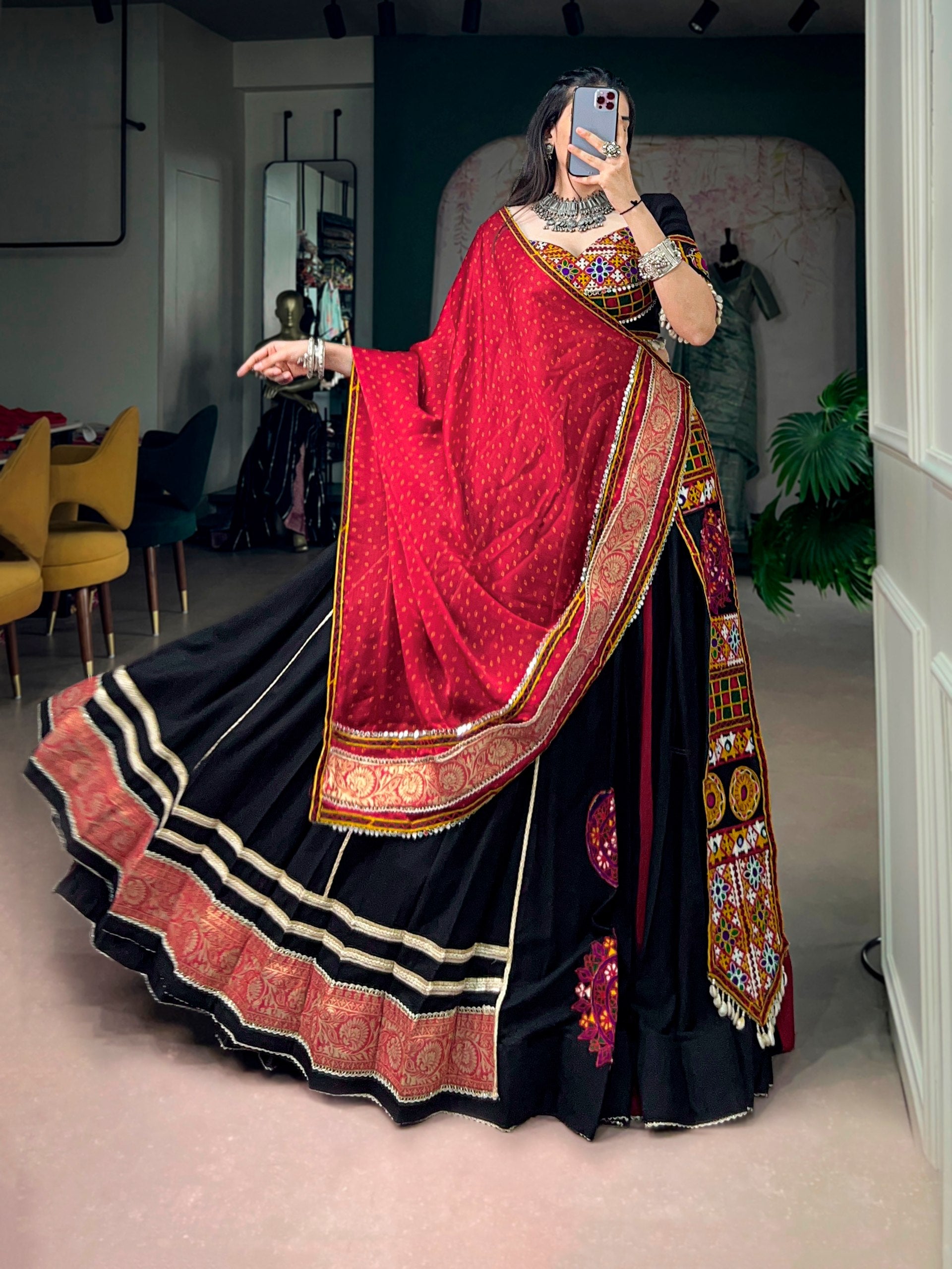 Model wearing Black & Red Rayon Fabric Lehenga Adorned With Kutchi Embroidery Patch Work And Jacquard Border Lace Navratri Lehenga Choli Set by The Beauty Queen