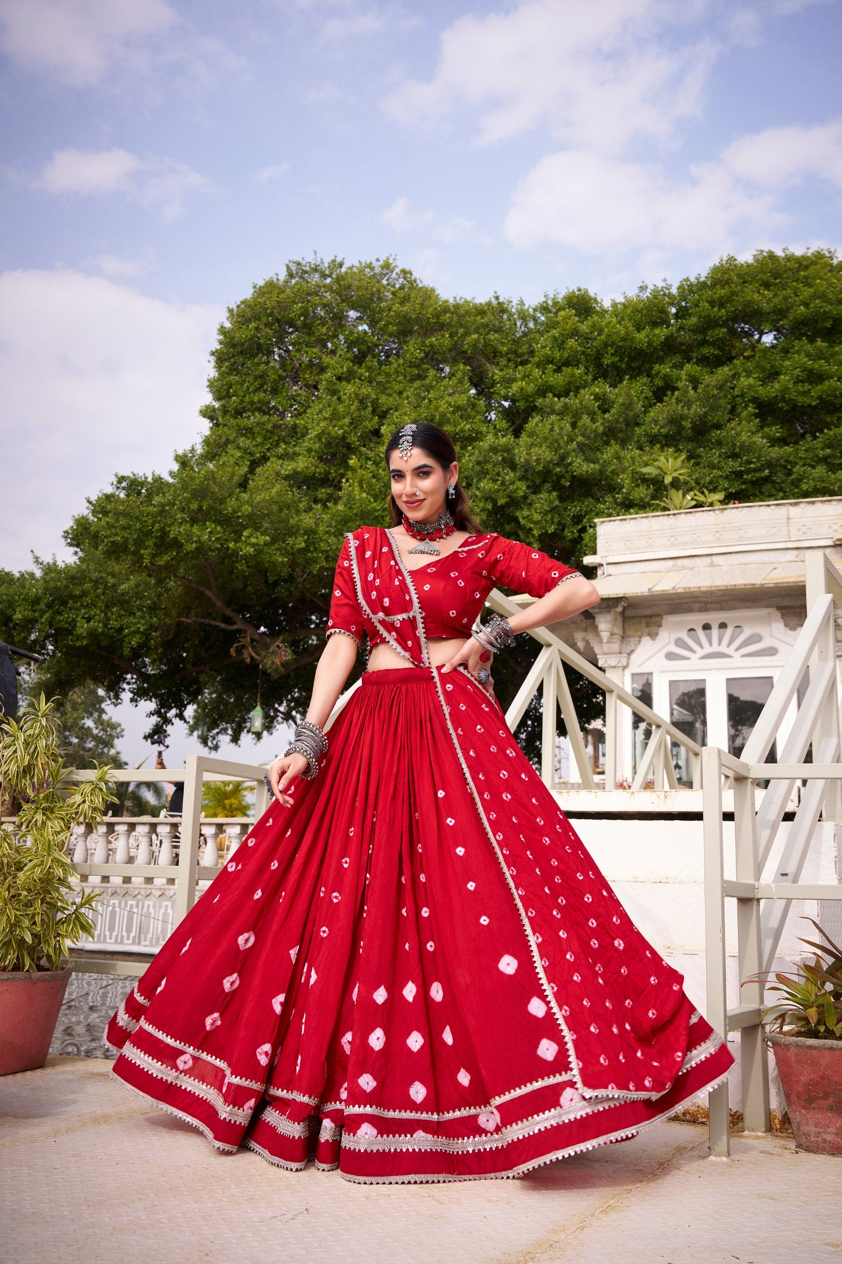 Model wearing Traditional Crimson Red Pure Chanderi Bandhej Print With Silver Lace Touch-Up Navratri Lehenga Choli Set by The Beauty Queen