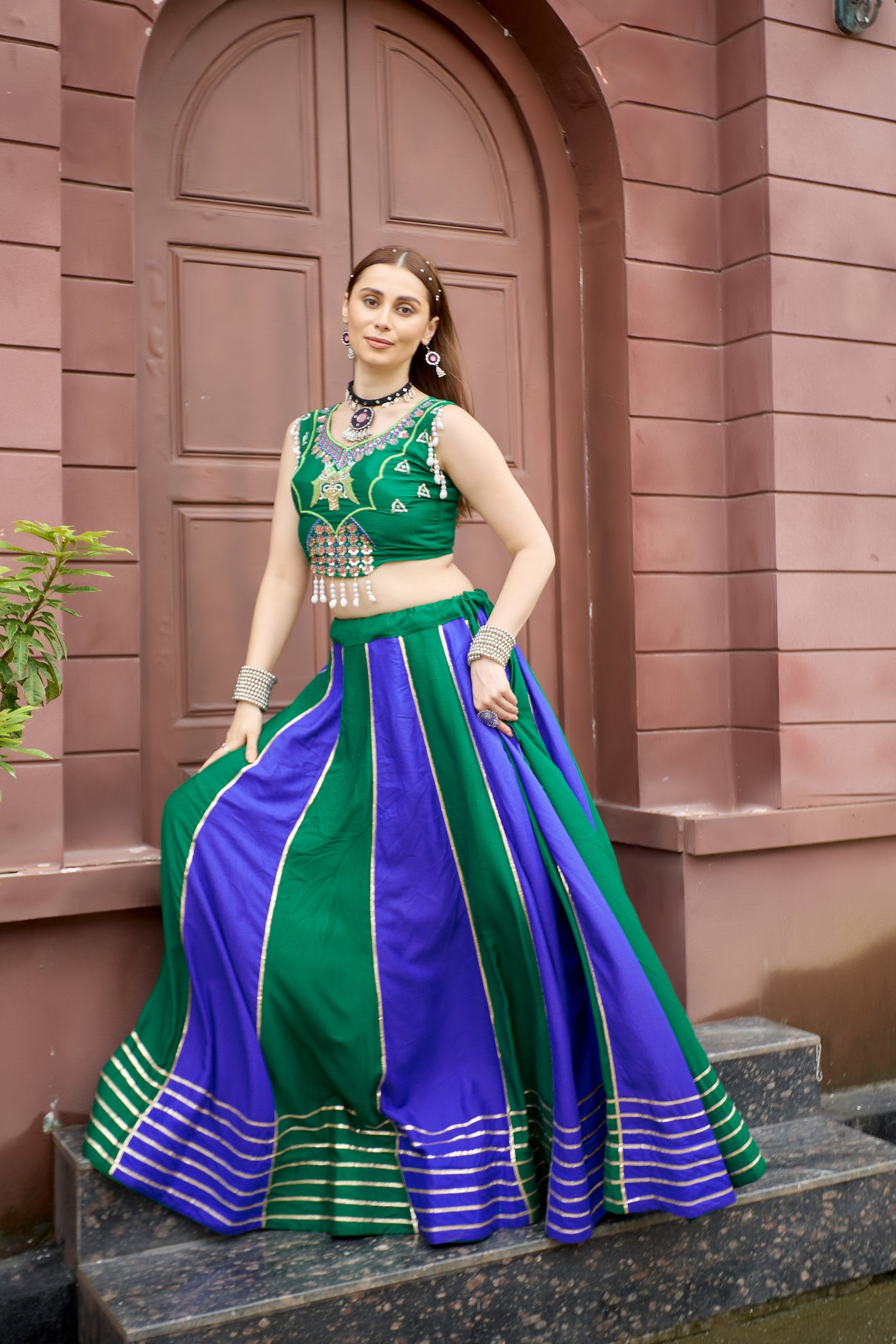 Model Wearing Emerald Green And Royal Blue Pure Cotton Heavy Lace Work Navratri Lehenga Choli Set By The Beauty Queen