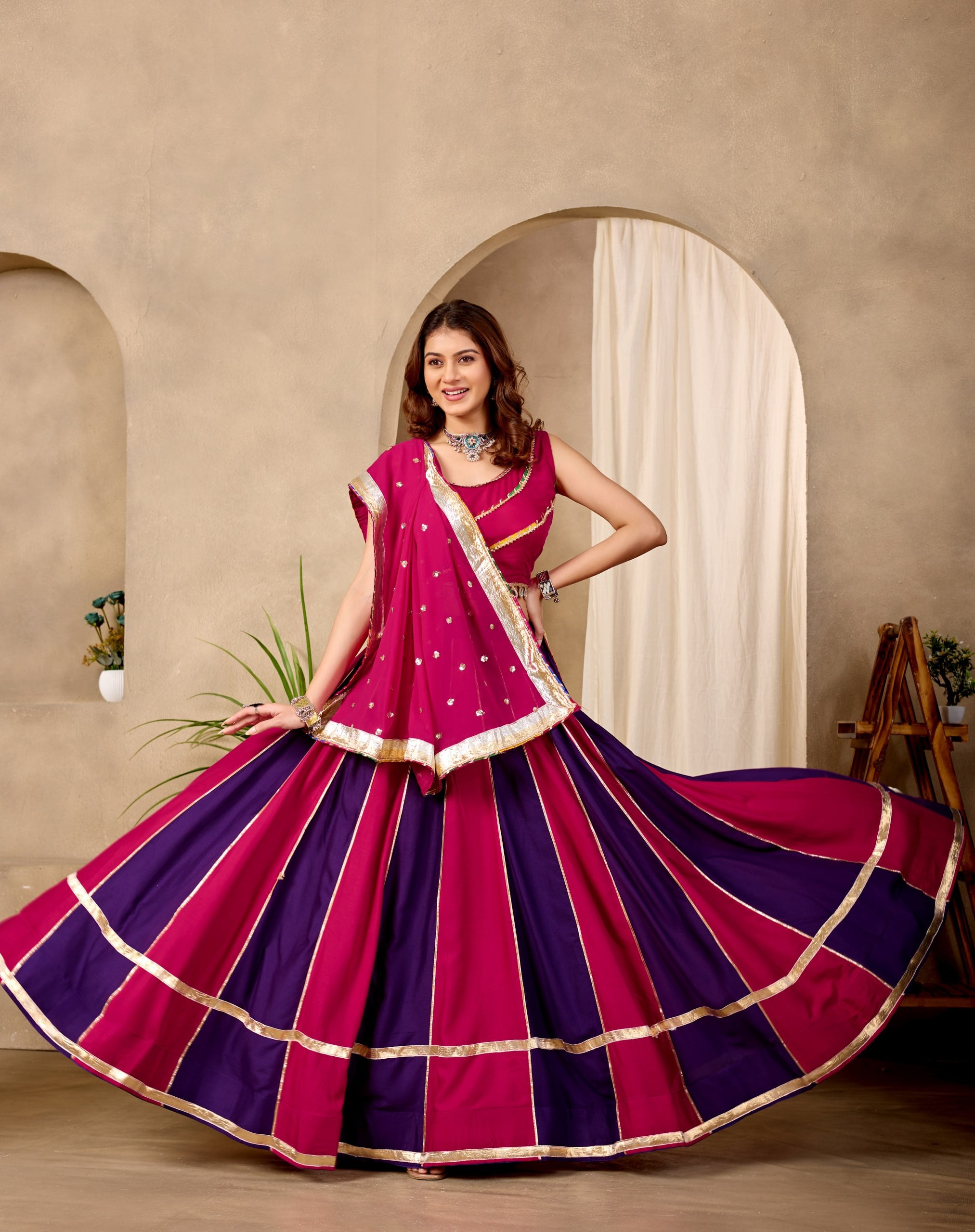 Model Wearing Magenta And Dark Purple Pure Cotton Fancy Lace And Mirror Work Lehenga Choli Set By The Beauty Queen