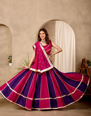 Model Wearing Magenta And Dark Purple Pure Cotton Fancy Lace And Mirror Work Lehenga Choli Set By The Beauty Queen