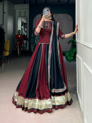 Model wearing Maroon & Black Chinon Fabric Enhanced With Embossed Designer Lace And Real Mirror Lace Detailing Navratri Lehenga Choli Set by The Beauty Queen
