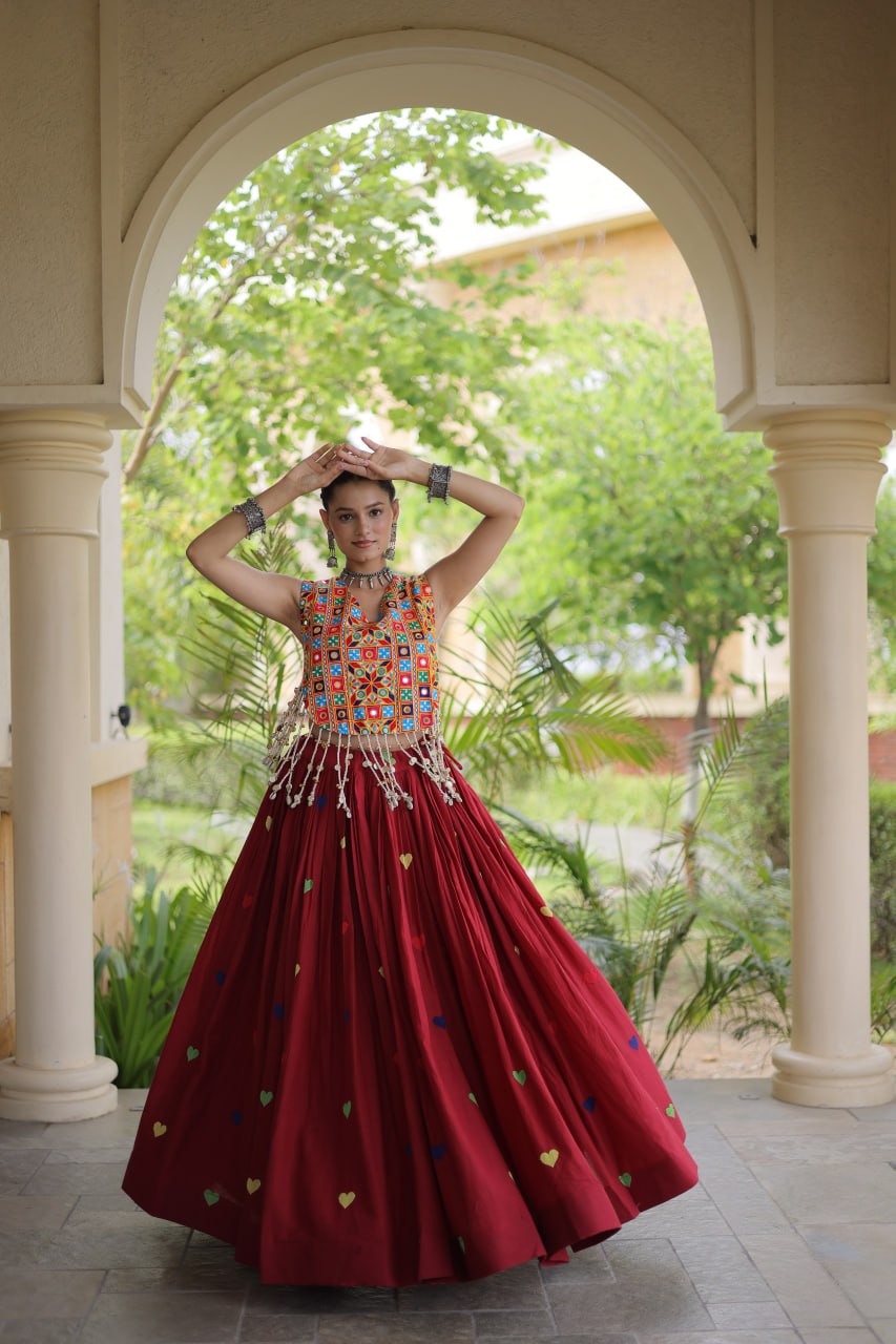 Model Posing In Maroon Red Cora Cotton Heart Thread Embroidery Navratri Lehenga Choli Set By The Beauty Queen