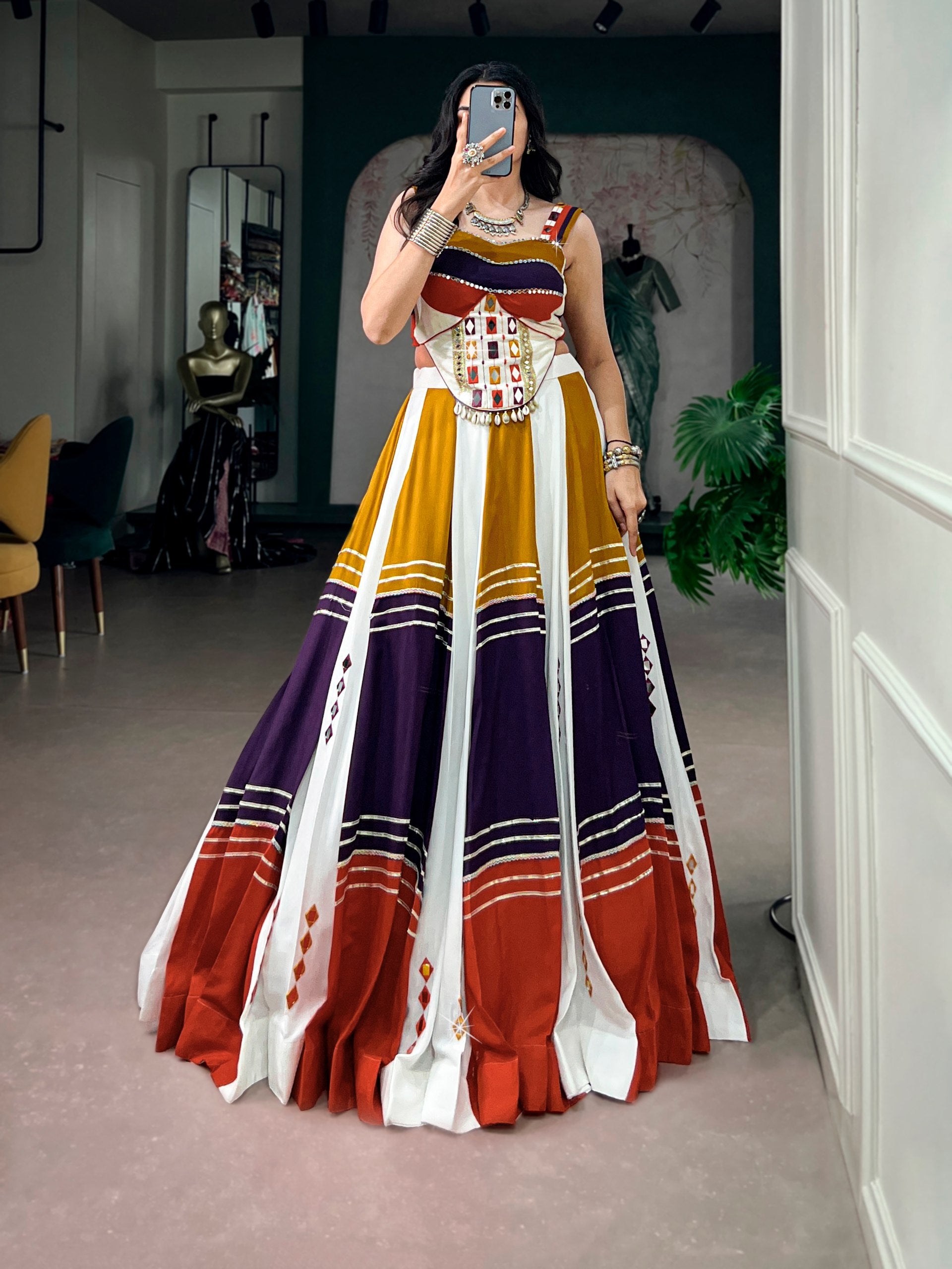 Model wearing Multi-Color Block Soft Rayon Fabric Embellished With Authentic Mirror Work And Gota Patti Lace Navratri Lehenga Choli Set by The Beauty Queen