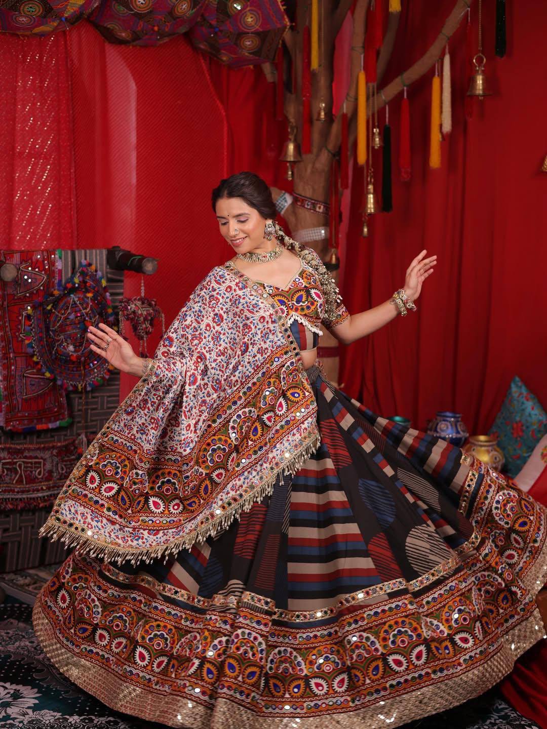 Model Posing In Multi-Color Striped Heavy Muslin Cotton With Real Mirror Work Navratri Lehenga Choli Set With White Printed Dupatta By The Beauty Queen